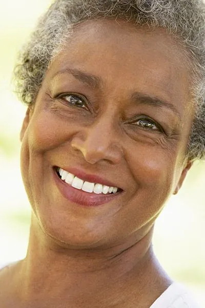 woman smiling after visiting Willamette Valley Periodontics
