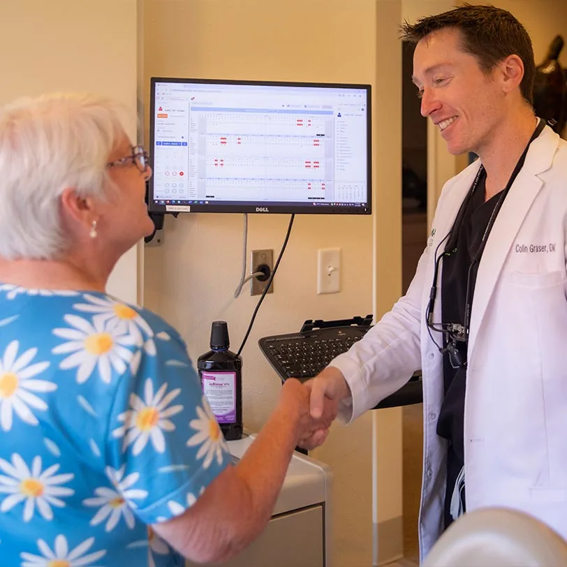 Dr. Colin Graser welcoming a new patient to Willamette Valley Periodontics